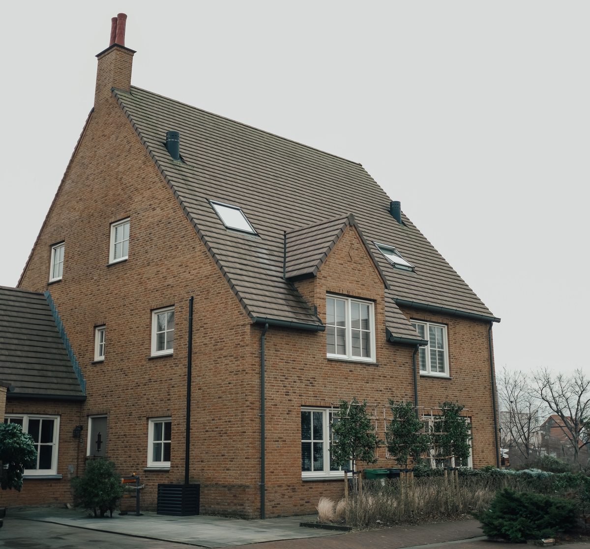 A large brick house let room by room